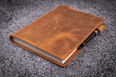 gray notebook with brown leather flap|Leather Notebook A5 in Brown .